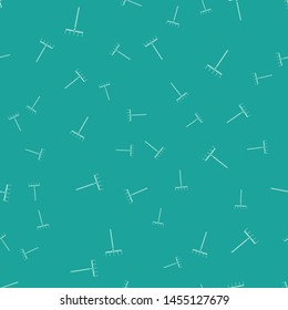 Green Garden rake icon isolated seamless pattern on green background. Tool for horticulture, agriculture, farming. Ground cultivator. Housekeeping equipment.  Vector Illustration