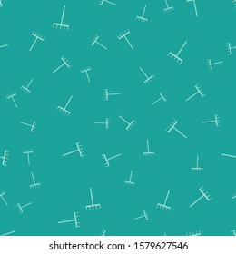 Green Garden rake icon isolated seamless pattern on green background. Tool for horticulture, agriculture, farming. Ground cultivator. Housekeeping equipment.  Vector Illustration
