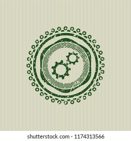 Green gear, team work icon inside distressed rubber grunge texture seal