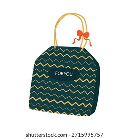 Una bolsa de regalo verde con un lazo naranja en el asa sobre un fondo blanco. Bolsa de regalo de papel, embalaje. Una caja de regalo festiva para el año Nuevo, cumpleaños y otras ocasiones.