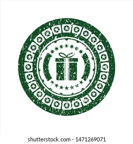 Green gift box icon inside distress rubber stamp with grunge texture