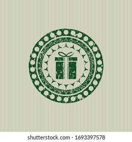 Green gift box icon inside distress grunge style stamp