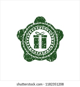Green gift box icon with rubber seal texture