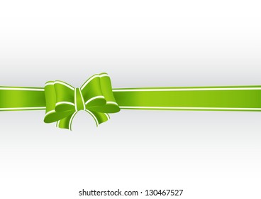 green gift ribbon tied in a bow