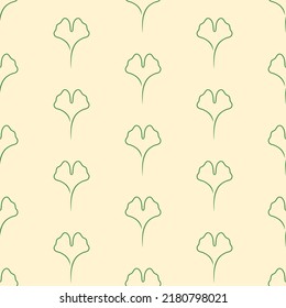 Green ginkgo heart shaped leafs on beige background. Floral seamless pattern. Minimalist trendy contemporary design. Best for textile, wallpapers, wrapping paper, package and home decoration.