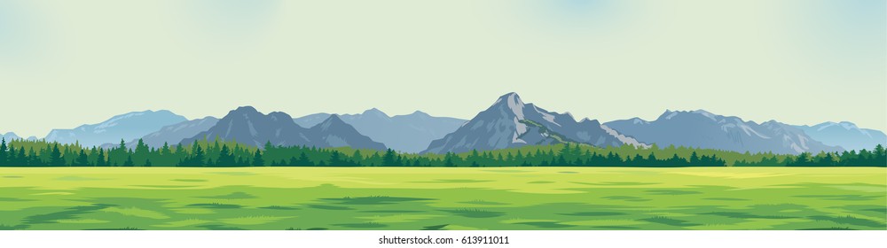 green glade against the background of mountains