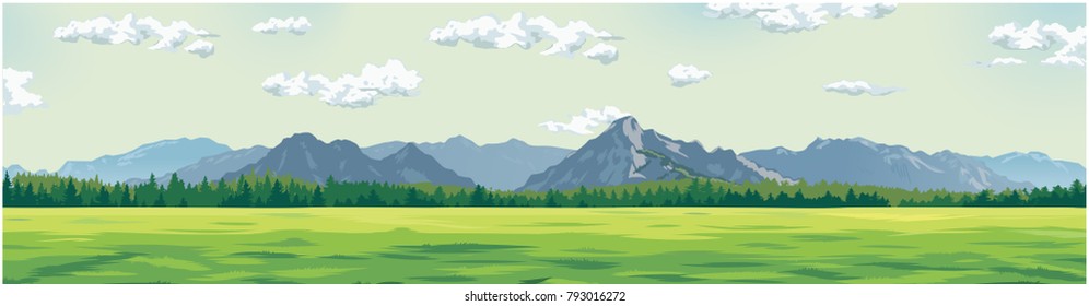 green glade against the background of mountains