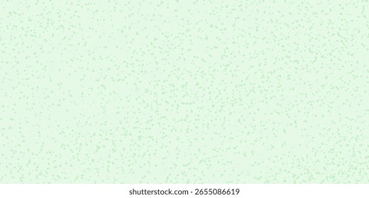 Green glitter texture on a bright green background.Smooth speckled abstract texture on a green background.