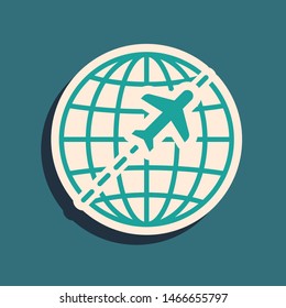 Green Globe with flying plane icon isolated on blue background. Airplane fly around the planet earth. Aircraft world icon. Long shadow style. Vector Illustration