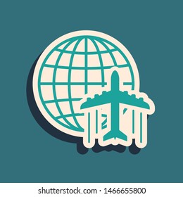Green Globe with flying plane icon isolated on blue background. Airplane fly around the planet earth. Aircraft world icon. Long shadow style. Vector Illustration