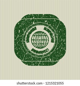 Green globe, website icon inside grunge stamp