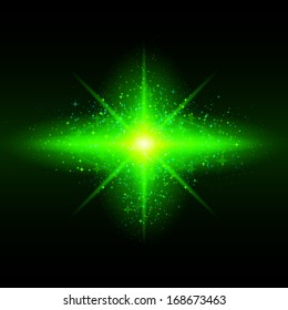 Green glowing galaxy with bright flare in centre on black background.