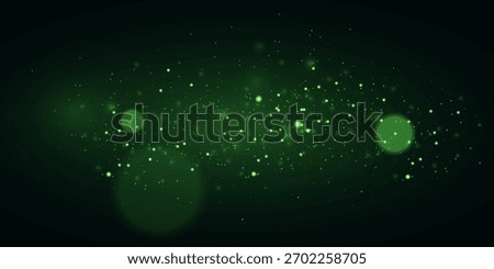 Green glowing particles on dark background