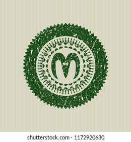 Green goat head icon inside distress rubber stamp with grunge texture