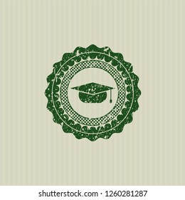 Green graduation cap icon inside distress rubber seal