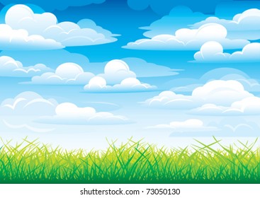 Green grass in a blue sky and clouds