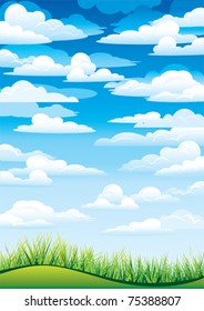 Green grass in a blue sky and clouds