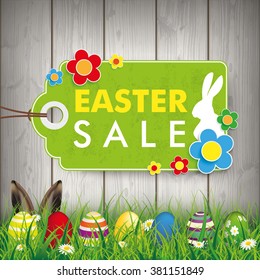 Green grass with colored easter eggs and price stickers for easter sale. Eps 10 vector file.