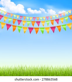 Green grass lawn with bright buntings clouds on blue sky