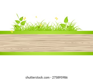 Green grass and leaves over wood fence background