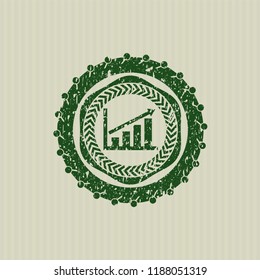 Green growth chart icon inside distressed rubber seal