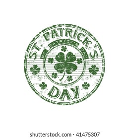 Green grunge rubber stamp with four leaf clover shape and the text St. Patrick's Day written inside the stamp