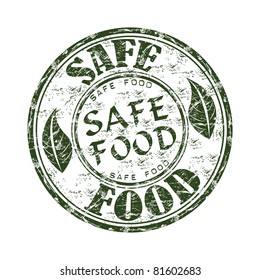 Green grunge rubber stamp with two leaves and the text safe food written inside the stamp