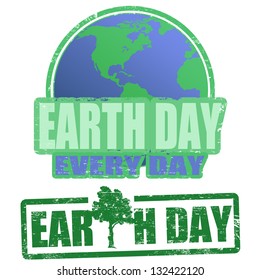 Green grunge rubber stamps with the text earth day written inside the stamp