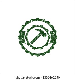 Green hammer icon inside distress grunge style stamp