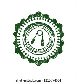 Green hand gripper icon inside distress rubber grunge stamp