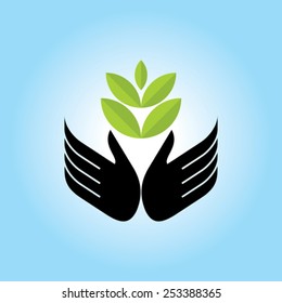 Green hand with green leaf over blue background