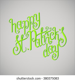 Green hand written St. Patrick's day greetings over light grey background.
