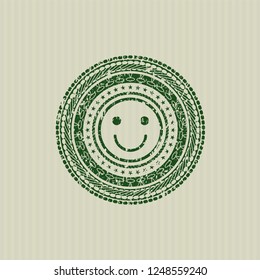 Green happy face icon inside rubber seal with grunge texture