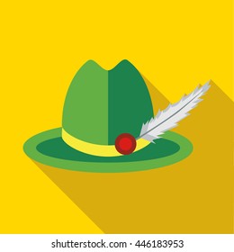 Green hat with a feather icon in flat style on a yellow background