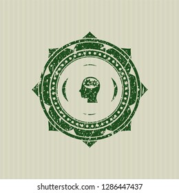 Green head with gears inside icon inside distressed rubber grunge texture stamp
