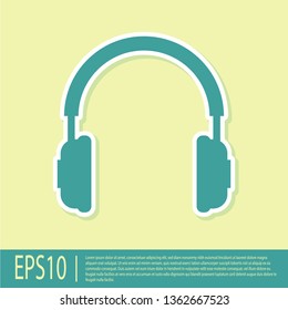 Green Headphones icon isolated on yellow background. Earphones sign. Concept object for listening to music, service, communication and operator. Flat design. Vector Illustration