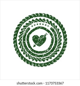 Green heart with arrow icon inside rubber texture