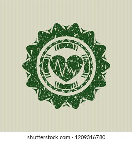 Green heart with electrocardiogram icon inside distress rubber texture