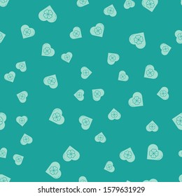 Green Heart with four leaf clover icon isolated seamless pattern on green background. Happy Saint Patrick day.  Vector Illustration