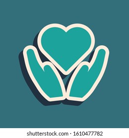 Green Heart on hand icon isolated on blue background. Hand giving love symbol. Valentines day symbol. Long shadow style. Vector Illustration