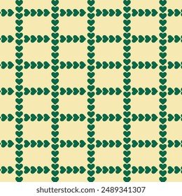 Green heart ribbon repeat pattern isolated on light yellow background.Seamless pattern with heart.Christmas background graphic vector illustration.