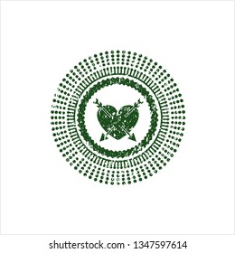 Green heart with two arrows icon inside distressed grunge stamp