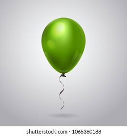 Green Helium Balloon With Ribbon Isolated On Grey Background