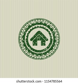 Green home icon inside distress rubber texture