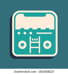 Green Home stereo with two speakers icon isolated on green background. Music system. Long shadow style. Vector.
