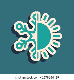 Green Hot and cold symbol. Sun and snowflake icon isolated on blue background. Winter and summer symbol. Long shadow style. Vector Illustration