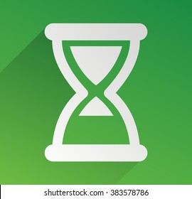 green hourglass with shadow