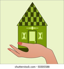 Green house in hand - environment concept
