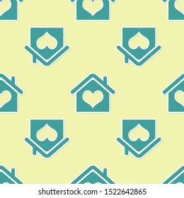 Green House with heart shape icon isolated seamless pattern on yellow background. Love home symbol. Family, real estate and realty.  Vector Illustration