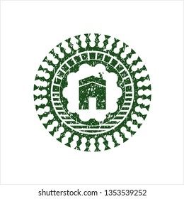 Green house icon inside distress rubber seal